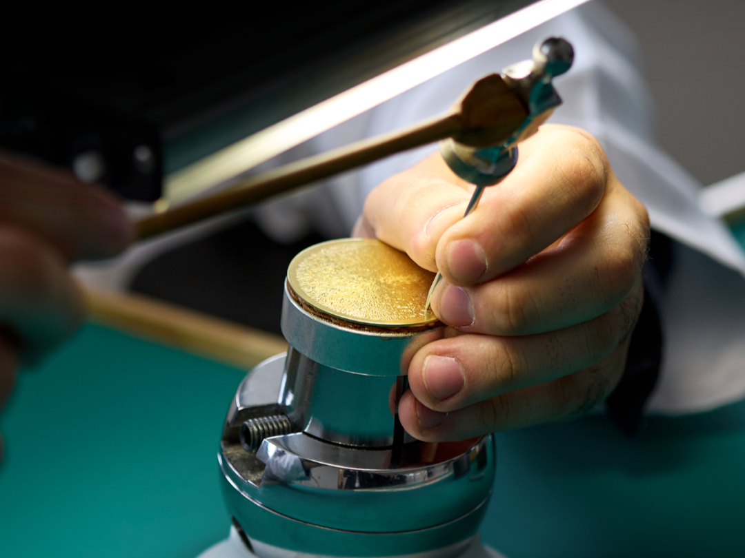 Martelage or hand hammering is a technique to decorate the dial that creates a radial hammered finish
