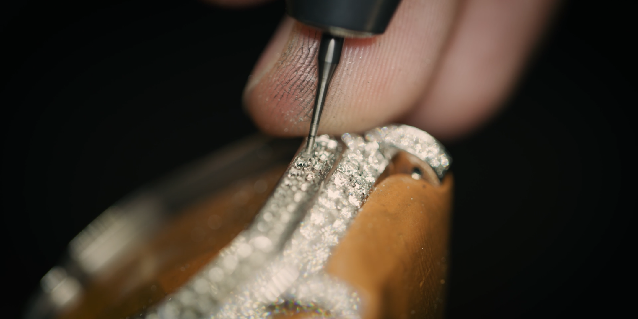 Diamonds are set by hand with precision and patience